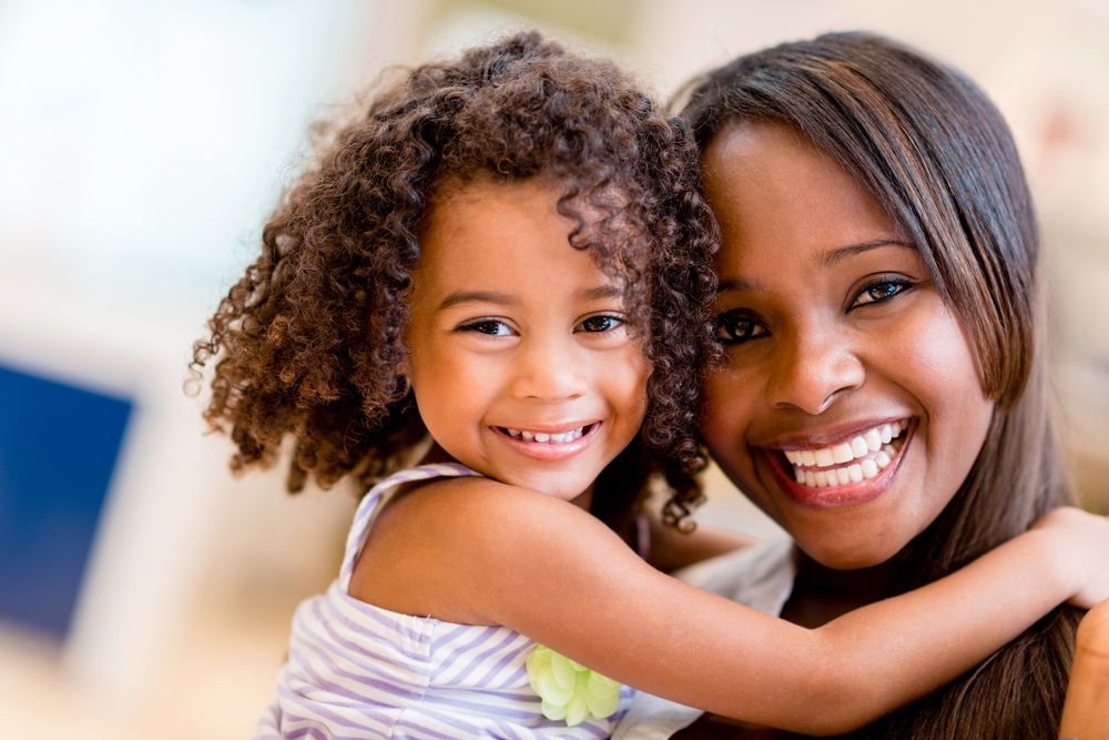Portrait of a mother and daughter smiling